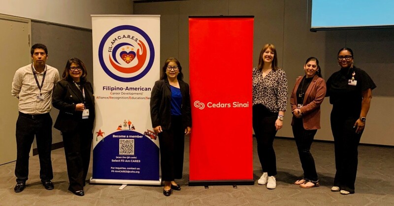 Janeth Zafra-Mauricio (middle) surrounded by speakers at Cedars-Sinai's admin training conference